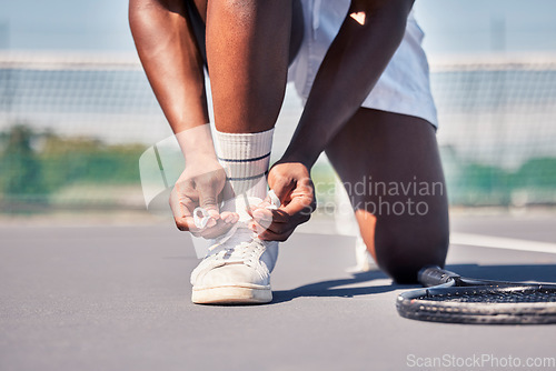 Image of Sports, tennis and man tie shoes before game start, competition or fitness exercise on outdoor tennis court. Wellness health, ground and legs of African player prepare for workout, training or cardio