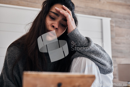 Image of Sad, depression and woman with frame in home looking at photo, feeling grief for death or loss. Mental health, anxiety or lonely female thinking of problems or frustrated after breakup alone in house