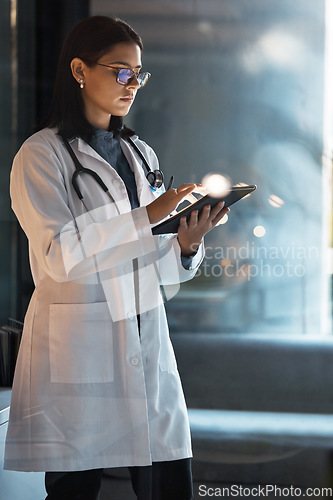 Image of Doctor, tablet and woman planning at night in medical office, hospital and clinic for research, test results information and connection. Focus healthcare worker, telehealth and digital app technology