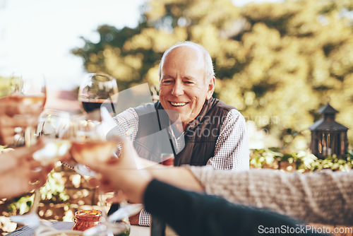 Image of Wine, cheers and grandpa in christmas toast with family for holiday celebration together with food and friends in garden. Hands, wine glasses and friendship, senior man with smile at dinner party