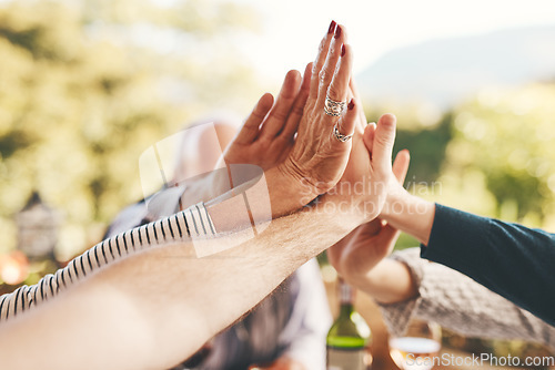 Image of Support, high five and community with hands of family at dinner table for celebration, happy and lunch together. Collaboration, faith and festive with friends relax for solidarity, unity and pride