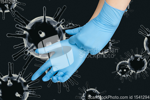 Image of Hand in protective gloves