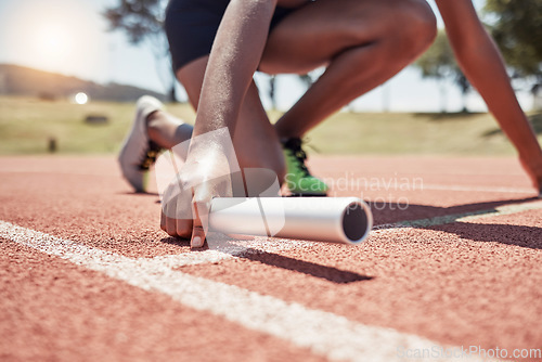 Image of Stadium, running sports and relay athlete on start track ready for race. Fitness, athletics and black woman with baton preparing for sprint, exercise and workout training for competition outdoors.