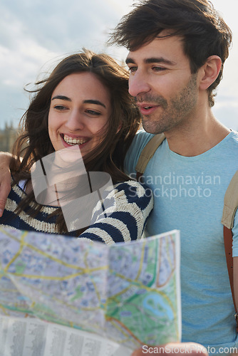 Image of Travel, map and vacation with a couple searching for directions while overseas or abroad on honeymoon. Love, navigation and sightseeing with a man and woman on the search for a tourist attraction