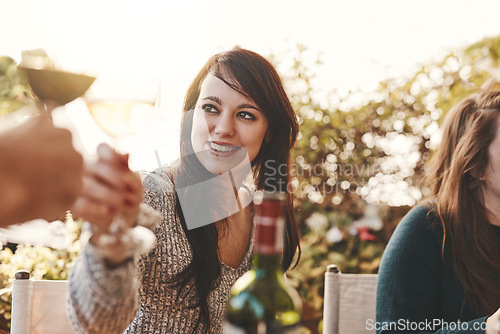 Image of Toast, celebration and woman with glass of wine at family lunch in a garden for Christmas. Cheers, party and girl with a drink of alcohol, wine glass and happiness during an outdoor dinner in nature