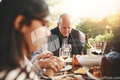 Image of Family party, celebration and praying before a lunch, Christmas and gathering with food in a backyard. Holding hands, gratitude and friends with a prayer for Thanksgiving dinner on a patio garden