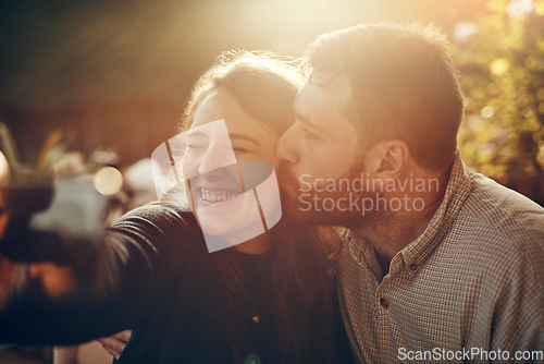 Image of Camera selfie, couple kiss and happiness outdoor in summer smile about bonding and care. Travel of a happy boyfriend and girlfriend in nature on a walking or hiking travel feeling freedom and love