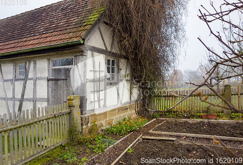 Image of old farmhouse at autumn time