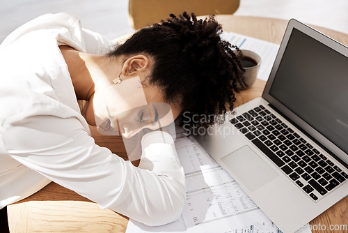Image of Black woman, laptop and burnout for startup company, sleeping and overworked at desk. Female entrepreneur, African American girl or business pressure, tired or depressed for work, frustrated or sleep