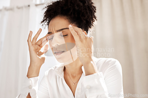 Image of Headache, stress and black woman in home with pain feeling exhausted, burnout and anxiety. Depression, mental health problems and stressed female holding head from discomfort, migraine and frustrated