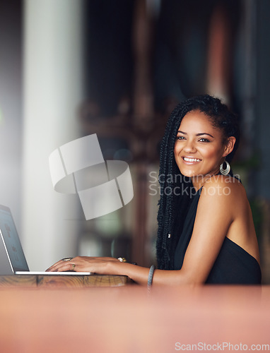 Image of Coffee shop, laptop and portrait of woman at a cafe for freelance, remote work and research, happy and relax. Black woman, restaurant and social media content creator writing for blog, vlog or post