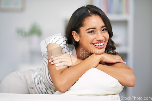 Image of Happy woman, sofa and smile portrait in home to relax with positive mindset, happiness and peace of natural beauty. Young female on living room couch in Brazil house for free time and wellness