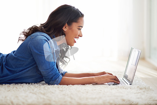 Image of Laptop, bed and woman relax with social media, streaming and internet, search and show in her home, happy and smile. Black woman, blog and influencer writing, content creator and posting in a bedroom