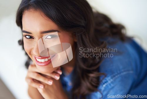 Image of Woman, face and happy to relax portrait on sofa in home for happiness or relaxing lifestyle. Young person, smile and mental health wellbeing or smiling for couch relaxation or positive thinking