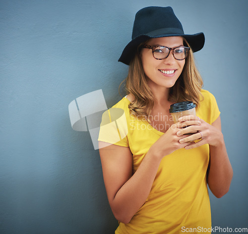 Image of Fashion, glasses and woman with coffee on wall with cappuccino, espresso and mock up space background. Aesthetics, designer hat and trendy female from Canada holding tea or hot beverage with mockup.