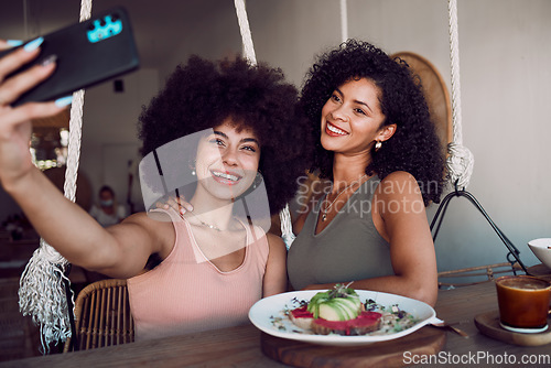 Image of Black women, friends and phone selfie at restaurant, cafe or small business for social media. Relax, tech and females on wifi taking picture with mobile smartphone for happy memory or internet post.