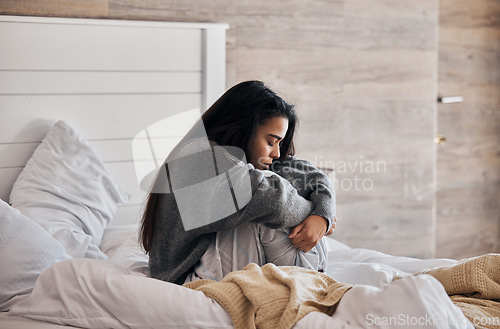 Image of Sad, depression and woman with stress in bedroom thinking of a break up, broken heart or mental health problems. Divorce, stressed or depressed girl with insomnia, anxiety or negative memory at home