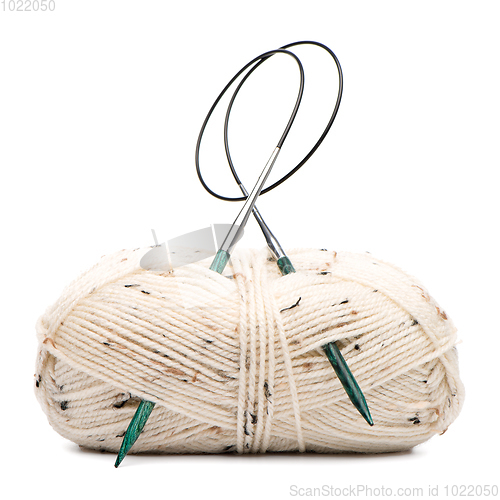 Image of Beige knitting wool with needles