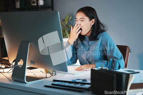 Image of Burnout, tired and business woman yawn in office working on computer for planning, research or marketing idea at night. Overwork, employee or sleepy girl with strain, insomnia or low energy at desk
