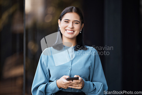 Image of Business woman, portait and smile with phone typing, happy to email or doing online, internet or web search. Career female with mobile smartphone working in social media marketing outdoor in the city