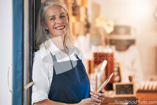 Image of Senior, store and owner portrait with tablet excited, happy and optimistic with shop career venture. Sales, small business and happiness of mature woman at shop entrance with welcoming smile.