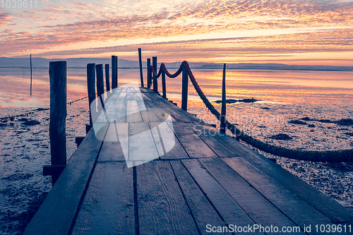 Image of Sunrise of a wooden pier