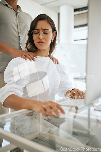 Image of Sexual harassment, uncomfortable and awkward with a business woman feeling negative about man hands on her shoulders. Stop, wrong and advantage with a female victim working on a computer in an office