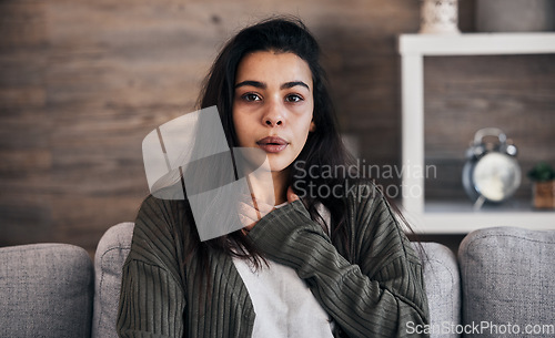 Image of Anxiety, worry and woman breathing on sofa to relax, calm down and stress relief from panic attack. Mental health, depression and portrait of anxious girl sitting on couch with hand on chest in pain