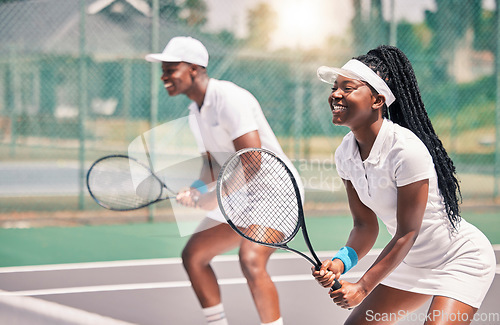 Image of Tennis, sports and competition with a black woman and doubles partner playing a game on a court outdoor together. Fitness, team and exercise with a man and female tennis player at a venue for sport