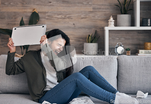 Image of Woman on sofa, angry and throwing laptop while crying in living room, breakup email or work stress at home. Mental health, depression and sad girl on couch with computer, glitch or 404 error burnout