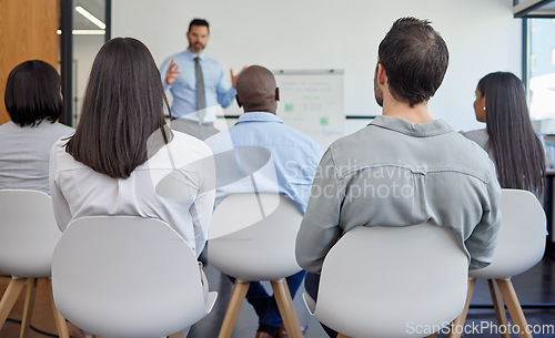 Image of Presentation, business people and manager in workshop meeting for office workflow management, finance strategy or KPI update. CEO, boss or leadership speaker and audience in professional conference