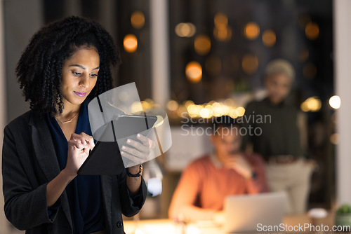 Image of Tablet, night and deadline with a business black woman doing research on the internet while working overtime. Technology, search and strategy with a female employee late at work after hours