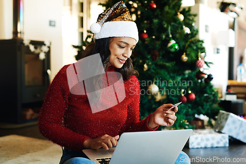 Image of Woman, laptop and credit card in ecommerce for Christmas gift, online shopping or banking at home. Happy female using computer and bank card for digital transaction, purchase or payment for presents