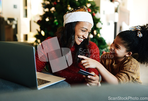 Image of Christmas, laptop and credit card with mother and girl for online shopping, gift or digital payment. Fintech, ecommerce and purchase with mom and child customer for celebration, holiday and xmas deal