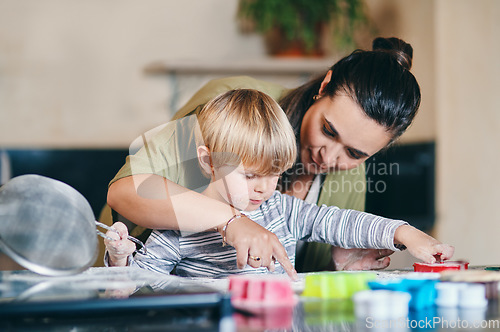 Image of Mother, boy child and teaching baking in kitchen for learning, domestic skills or cookie in family home. Cooking, mama and son in house for education, cookies or food with love, care or development