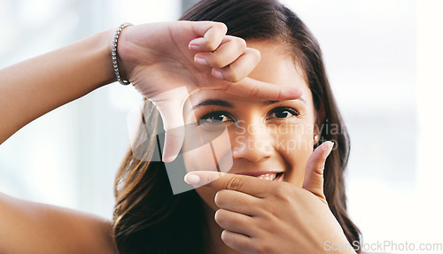 Image of Portrait, hand and frame in studio for photography, and creative vision or ambition on white background, Hands, finger and border with face of girl photographer, direct and picture perfect mockup