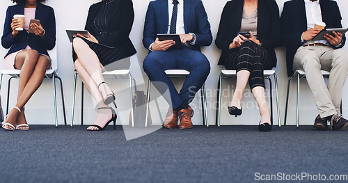 Image of Line, group and business people for interview using tech devices while waiting for hr recruitment. Row, businesspeople and hiring or hire candidates wait in queue for professional opportunity