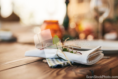 Image of Closeup, dinner table and setting with a napkin and ties to celebrate with a festive meal or food. Holiday, dining table and dish for a dinner or lunch with an empty bokeh background with nobody