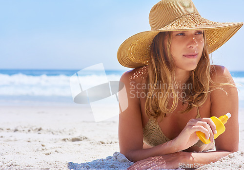 Image of Woman, beach and sunscreen while on a tropical vacation in Bali for rest and relaxation. Skincare, protection and suncream with a female tourist on a seaside holiday while using cream on the sand