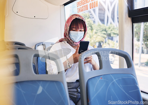 Image of Travel, covid and phone with muslim woman on bus by window for safety, technology and public transport. Health, internet and social media with girl typing on mobile for communication, global or virus