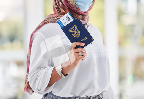 Image of Covid, passport and travel with a muslim woman in airport for international or global traveling and tourism. Hand, documents and immigration with an islamic female passenger walking in a terminal