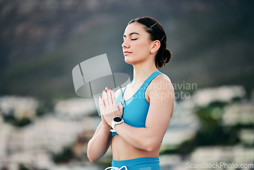 Image of Zen meditation, pray hands and woman outdoor for spiritual fitness, mental health and healthy faith exercise. Yoga, chakra wellness training and peace mindset motivation or mindfulness in nature