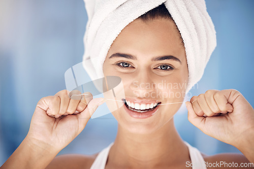 Image of Face, dental and woman flossing teeth for oral health and hygiene. Portrait, tooth wellness and happy, healthy and young female from Canada with smile cleaning mouth for dental care in the morning