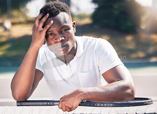 Image of Black man, tennis and stress, anxiety with fitness and outdoor on tennis court, holding head and frustrated, game fail or mistake in training. Exercise, wellness and sport portrait with angry athlete