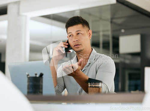 Image of Phone call, laptop and explain with a business man talking or negotiating a deal using mobile communication. Computer, discussion and smartphone with a male employee working on negotiation in office