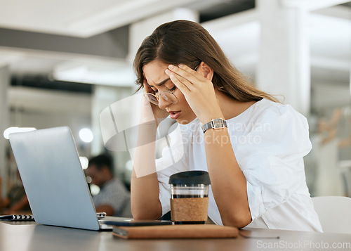 Image of Freelance woman, burnout headache and head pain from work stress, overtime and mental health fatigue problem. Remote worker, tired and unwell while suffering from bad migraine, anxiety and exhaustion