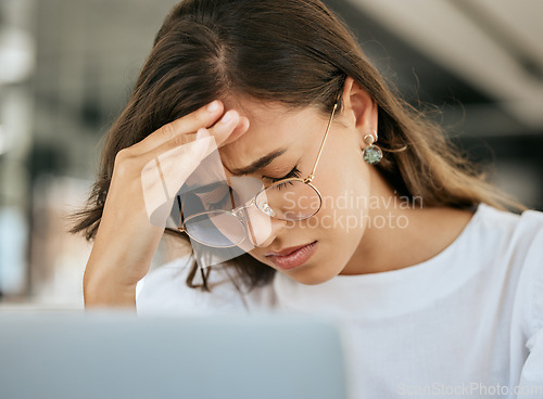 Image of Stress, headache and office burnout of a business woman experience a computer glitch. Working employee with a 404, audit and online problem feeling anxiety and mental health issue at her office job