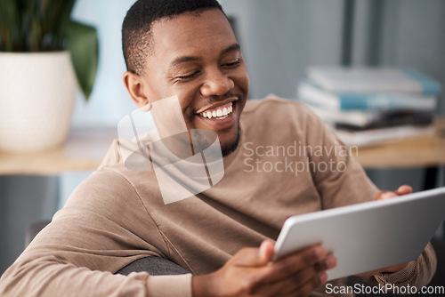 Image of Black man, tablet and happiness of a person on a living room sofa with technology online. Social media content, video streaming or meme of a man smile on a house couch on wifi and web at home