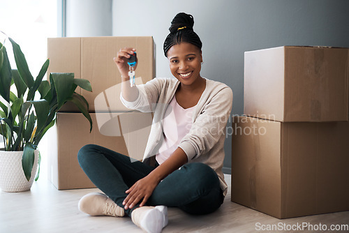 Image of Boxes, black woman and homeowner with keys, to new home and happiness in home. Property, African American female and lady moving into house, happy and content with apartment, excited and portrait.