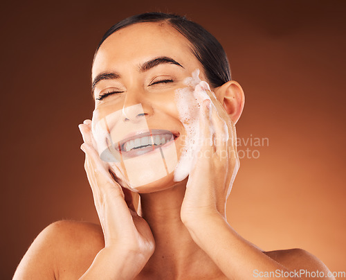 Image of Skincare, hands and foam on face for cleaning with smile, happiness and spa wellness. Facial wash, luxury cosmetics therapy and self care with soap for beauty, dermatology grooming and cosmetology